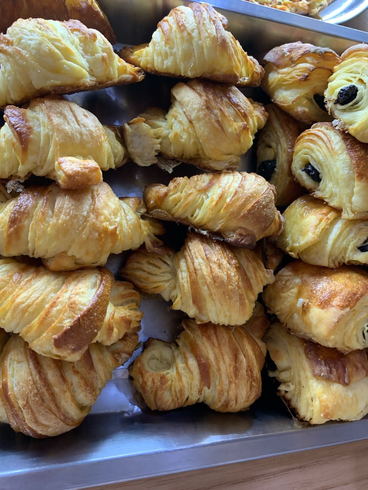 Fresh croissants with perfect golden layers